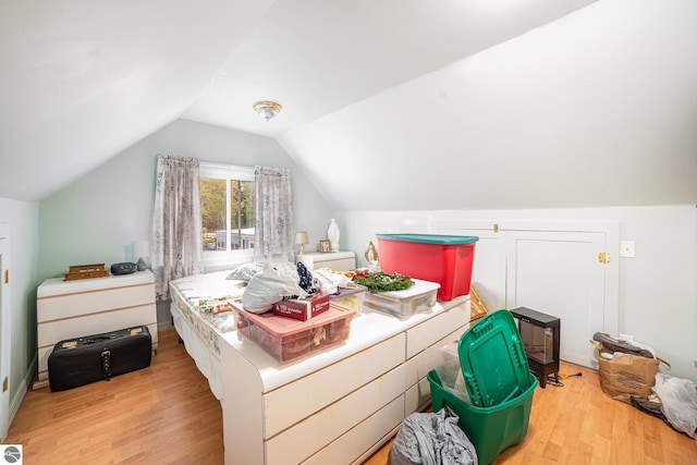 5817 Gross Dr, Weidman, MI 48893 - bedroom featuring light wood-style flooring and vaulted ceiling