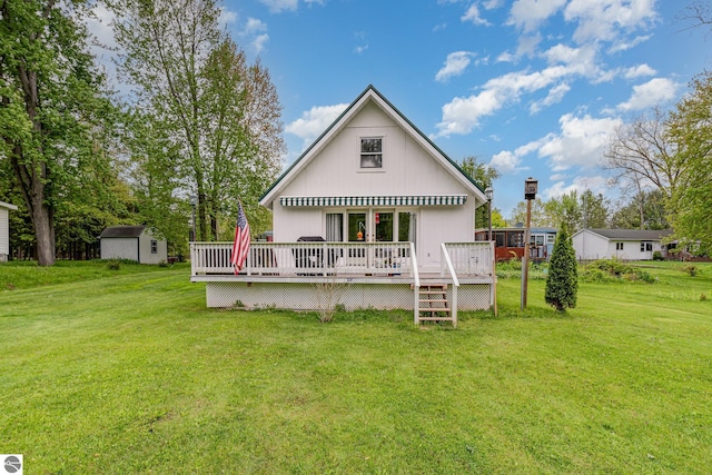 5817 Gross Dr, Weidman, MI 48893 - rear view of property with a wooden deck and a lawn