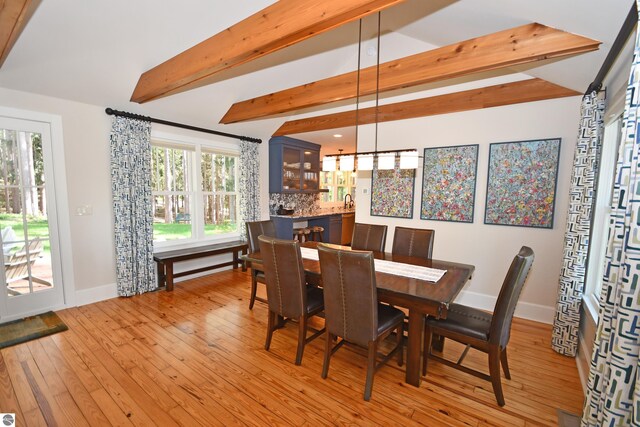 9017 S Dunns Farm Rd, Maple City, MI 49664 - dining room featuring baseboards and light wood-style floors