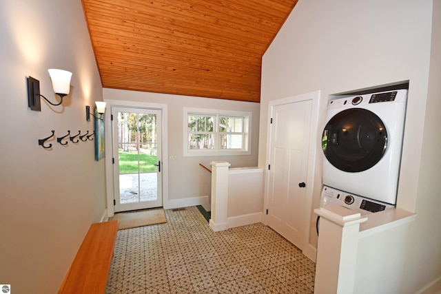 9017 S Dunns Farm Rd, Maple City, MI 49664 - laundry room with stacked washer / drying machine, wooden ceiling, a high ceiling, baseboards, and light flooring