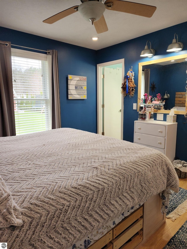 6368 Hardwood Dr, Lake Ann, MI 49650 - bedroom featuring wood finished floors and ceiling fan