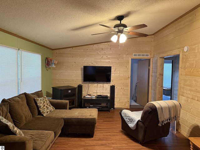 6661 Terry Ln, Hale, MI 48739 - living area with lofted ceiling, ceiling fan, wood walls, wood finished floors, and a textured ceiling