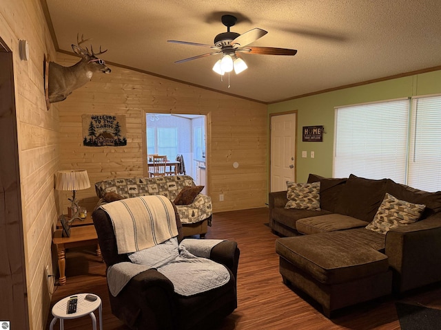 6661 Terry Ln, Hale, MI 48739 - living room featuring vaulted ceiling, crown molding, wood finished floors, a textured ceiling, and ceiling fan