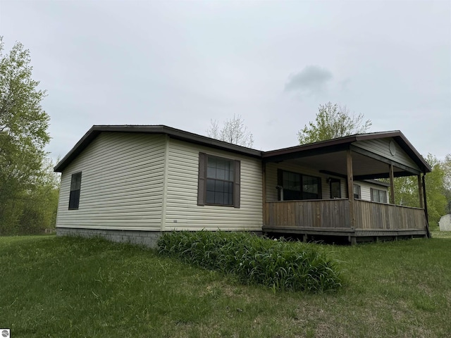 6661 Terry Ln, Hale, MI 48739 - view of side of home with a lawn