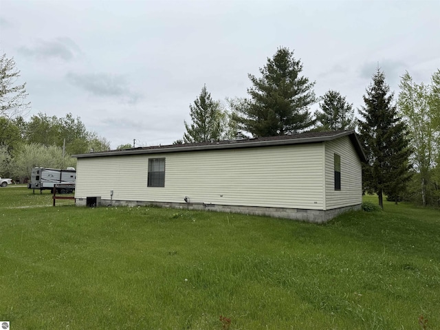 6661 Terry Ln, Hale, MI 48739 - view of side of home with crawl space and a lawn