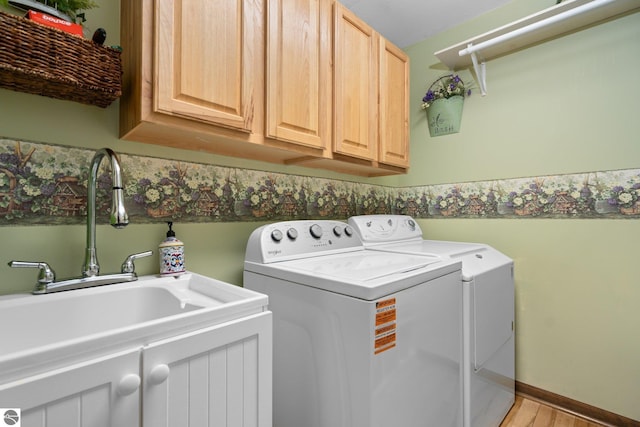 4611 Audubon Dr, Traverse City, MI 49686 - laundry area with washer and dryer and cabinet space