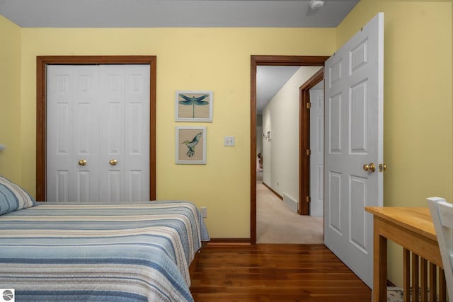 4611 Audubon Dr, Traverse City, MI 49686 - bedroom featuring wood finished floors, baseboards, and a closet