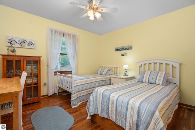 4611 Audubon Dr, Traverse City, MI 49686 - bedroom featuring wood finished floors, baseboards, and a ceiling fan