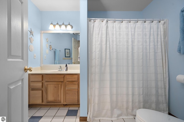 4611 Audubon Dr, Traverse City, MI 49686 - bathroom featuring vanity, toilet, tile patterned flooring, and curtained shower
