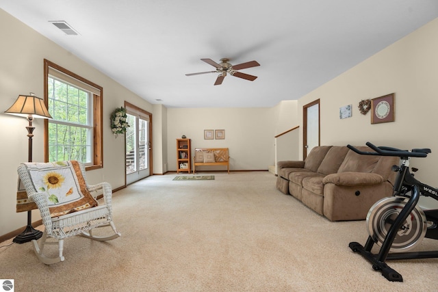 4611 Audubon Dr, Traverse City, MI 49686 - living room featuring ceiling fan, carpet flooring, and baseboards