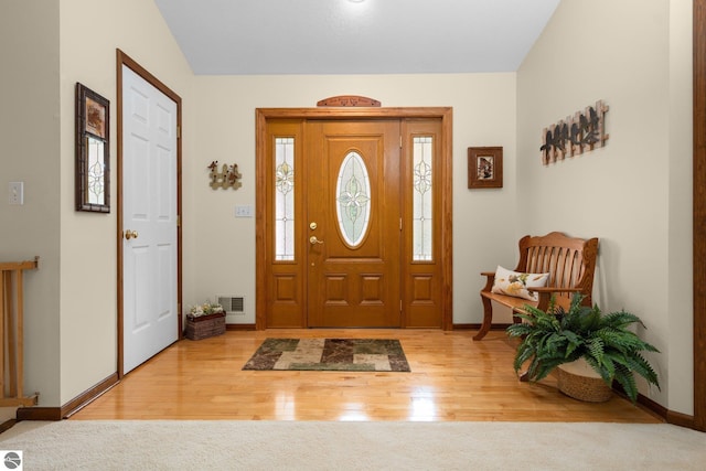 4611 Audubon Dr, Traverse City, MI 49686 - foyer entrance with baseboards and wood finished floors