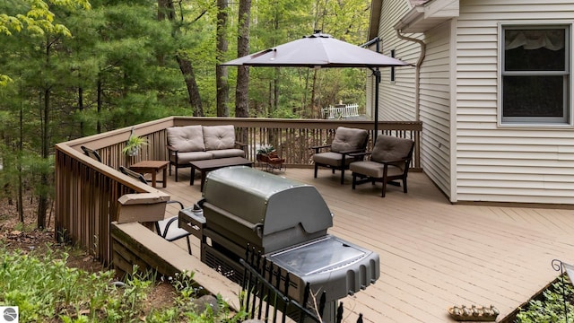 4611 Audubon Dr, Traverse City, MI 49686 - wooden deck with outdoor lounge area and a view of trees