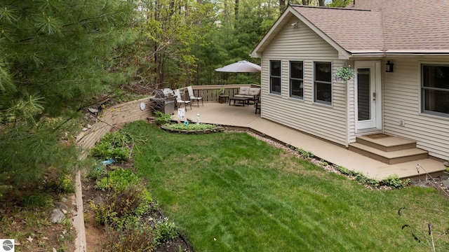 4611 Audubon Dr, Traverse City, MI 49686 - view of green lawn with a deck