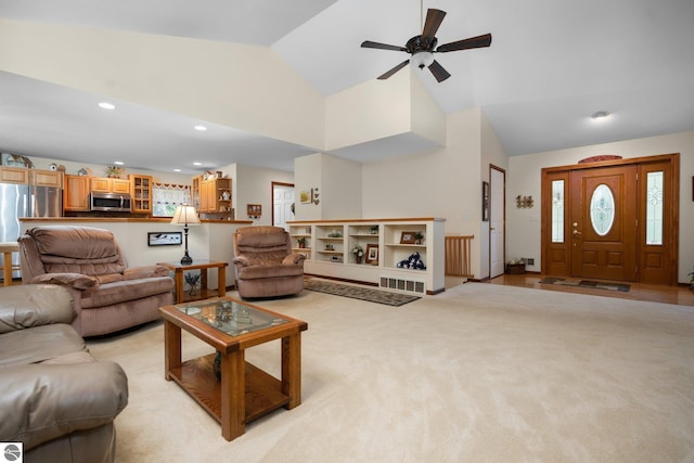 4611 Audubon Dr, Traverse City, MI 49686 - living room with a ceiling fan, recessed lighting, high vaulted ceiling, and light carpet