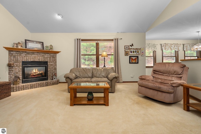 4611 Audubon Dr, Traverse City, MI 49686 - carpeted living area featuring lofted ceiling, a brick fireplace, and baseboards