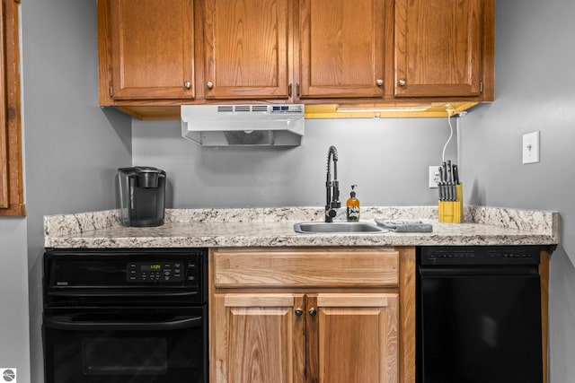 6519 Schuss Mountain Ln Unit 3511-3512, Mancelona, MI 49659 - kitchen with oven, a sink, under cabinet range hood, and light stone counters