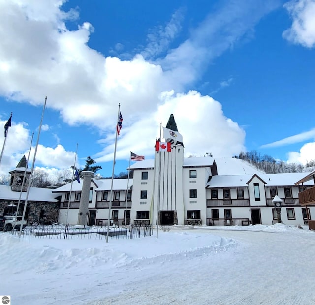 6519 Schuss Mountain Ln Unit 3511-3512, Mancelona, MI 49659 - snow covered building with a residential view