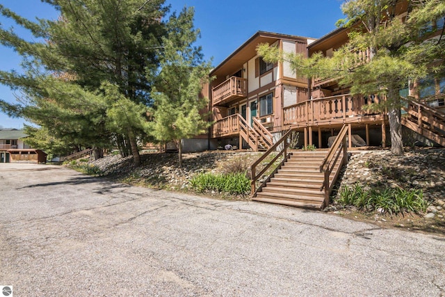 6519 Schuss Mountain Ln Unit 3511-3512, Mancelona, MI 49659 - view of building exterior with stairway