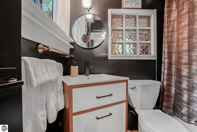 10092 S Elm St, Traverse City, MI 49684 - full bathroom with vanity, toilet, and curtained shower