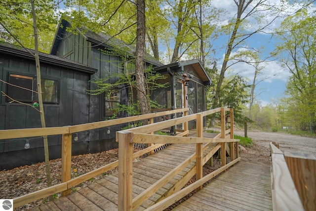 10092 S Elm St, Traverse City, MI 49684 - deck featuring a sunroom and driveway