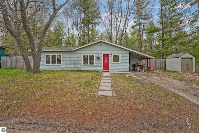 1615 Pine Dr, Traverse City, MI 49686 - view of front of house with asphalt driveway and a carport