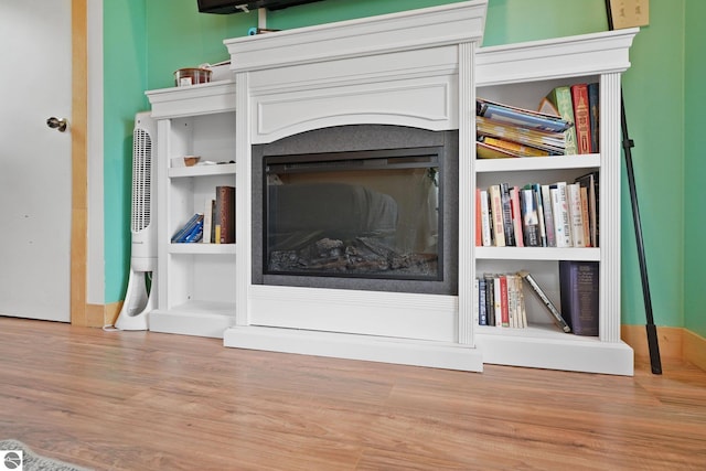 1615 Pine Dr, Traverse City, MI 49686 - detailed view of wood finished floors and a fireplace