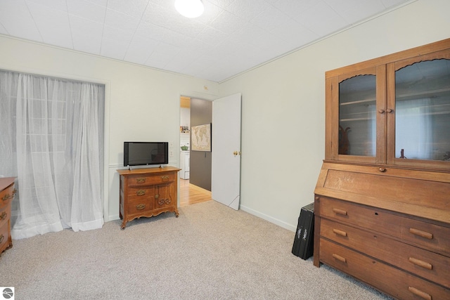 1615 Pine Dr, Traverse City, MI 49686 - bedroom with light colored carpet and baseboards