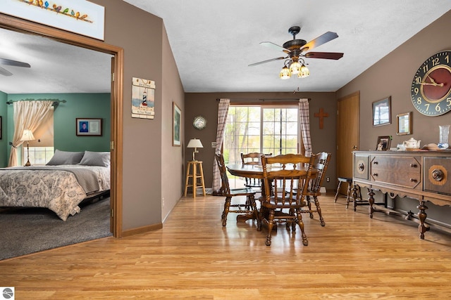 5206 S Riverview Dr, Lake City, MI 49651 - dining space featuring a ceiling fan, light wood-type flooring, and baseboards