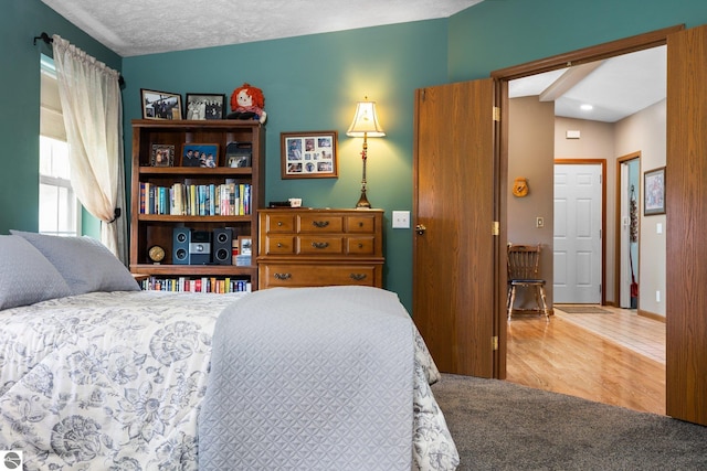 5206 S Riverview Dr, Lake City, MI 49651 - bedroom featuring wood finished floors