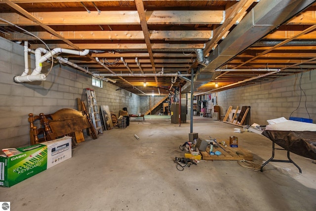 5206 S Riverview Dr, Lake City, MI 49651 - unfinished below grade area featuring concrete block wall and heating unit