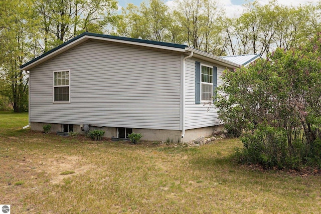 5206 S Riverview Dr, Lake City, MI 49651 - view of side of property featuring a lawn