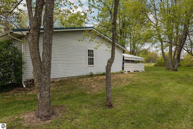5206 S Riverview Dr, Lake City, MI 49651 - view of home's exterior with a yard