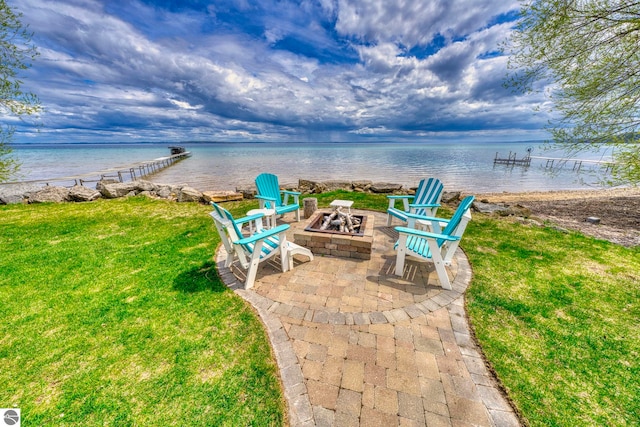 6433 S W Bayshore Dr, Traverse City, MI 49684 - view of patio / terrace with a fire pit and a water view