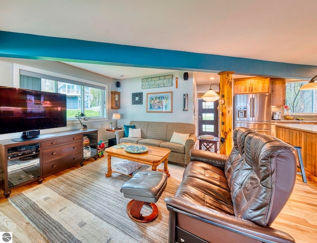 6433 S W Bayshore Dr, Traverse City, MI 49684 - living area with light wood-style flooring and healthy amount of natural light