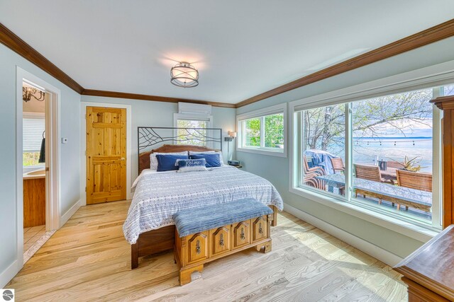 6433 S W Bayshore Dr, Traverse City, MI 49684 - bedroom with baseboards, light wood-style flooring, and ornamental molding