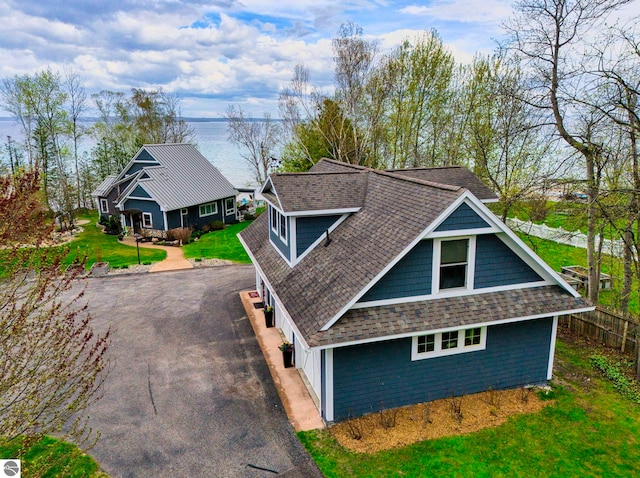6433 S W Bayshore Dr, Traverse City, MI 49684 - view of front of house with driveway and a shingled roof