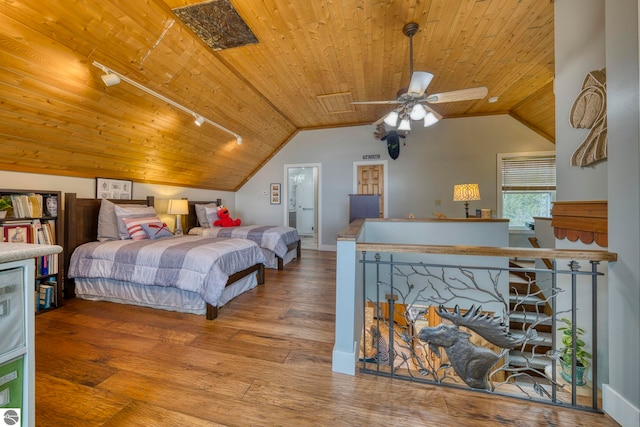 6433 S W Bayshore Dr, Traverse City, MI 49684 - bedroom featuring rail lighting, wooden ceiling, vaulted ceiling, and hardwood / wood-style floors