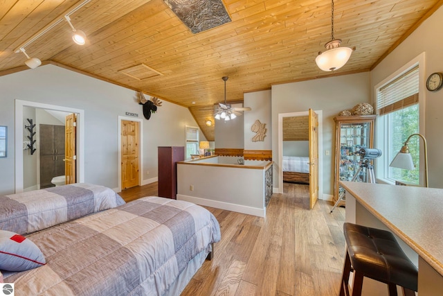 6433 S W Bayshore Dr, Traverse City, MI 49684 - bedroom with wood ceiling, track lighting, light wood-style floors, lofted ceiling, and baseboards