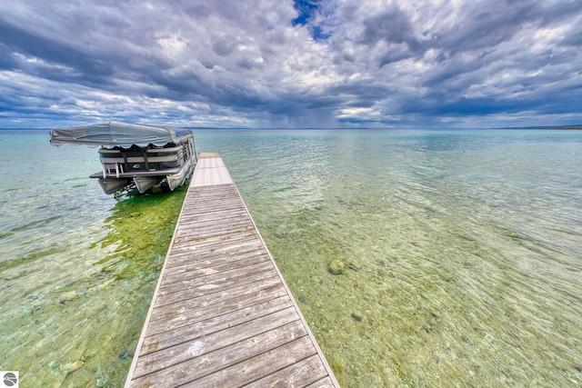 6433 S W Bayshore Dr, Traverse City, MI 49684 - dock area featuring a water view and boat lift