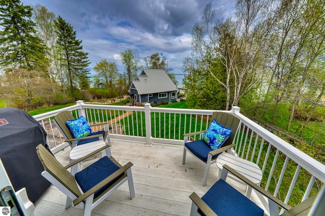 6433 S W Bayshore Dr, Traverse City, MI 49684 - deck with area for grilling and a yard
