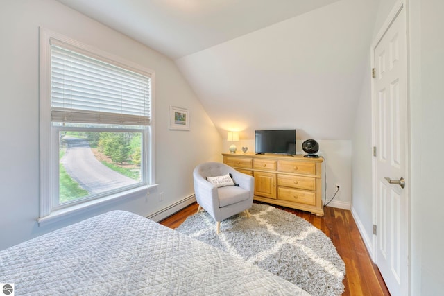 6433 S W Bayshore Dr, Traverse City, MI 49684 - bedroom featuring a baseboard radiator, lofted ceiling, wood finished floors, and baseboards