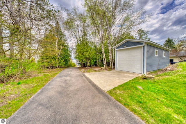 6433 S W Bayshore Dr, Traverse City, MI 49684 - detached garage featuring driveway