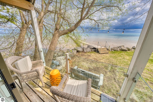 6433 S W Bayshore Dr, Traverse City, MI 49684 - wooden terrace with a water view