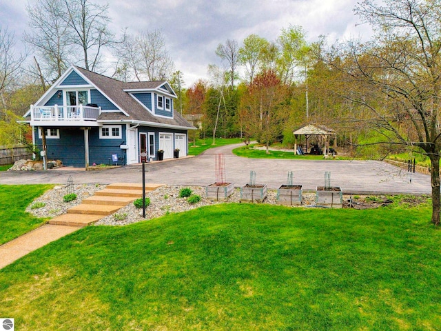 6433 S W Bayshore Dr, Traverse City, MI 49684 - view of grassy yard with a gazebo and a balcony