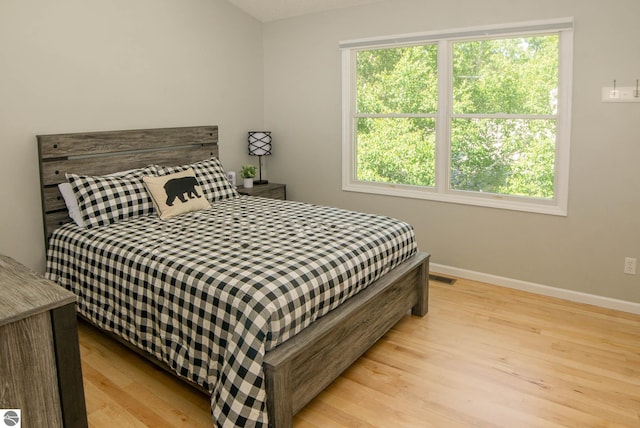 314 Leelanau Ave, Frankfort, MI 49635 - bedroom featuring wood finished floors and baseboards