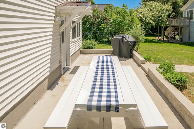 314 Leelanau Ave, Frankfort, MI 49635 - deck featuring a yard, grilling area, a patio, and stairway