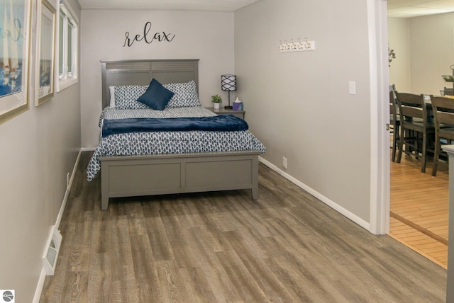 314 Leelanau Ave, Frankfort, MI 49635 - bedroom featuring wood finished floors and baseboards