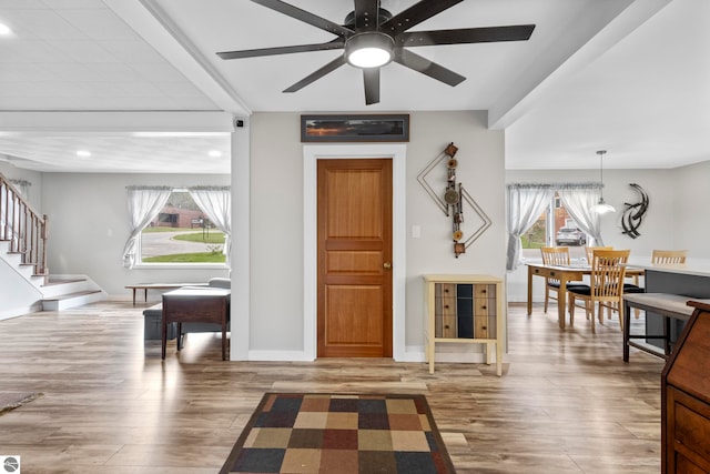7256 Highland Dr, Beulah, MI 49617 - entryway featuring wood finished floors, a ceiling fan, stairway, baseboards, and recessed lighting