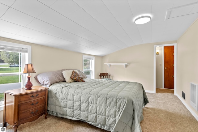 7256 Highland Dr, Beulah, MI 49617 - bedroom featuring light carpet, lofted ceiling, and baseboards