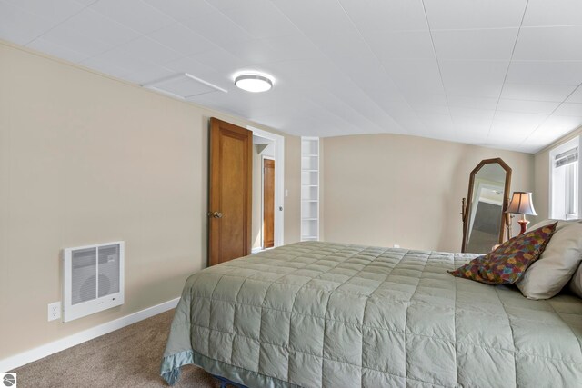 7256 Highland Dr, Beulah, MI 49617 - carpeted bedroom with heating unit and baseboards